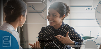 Photo of manager and employee taking back performance management